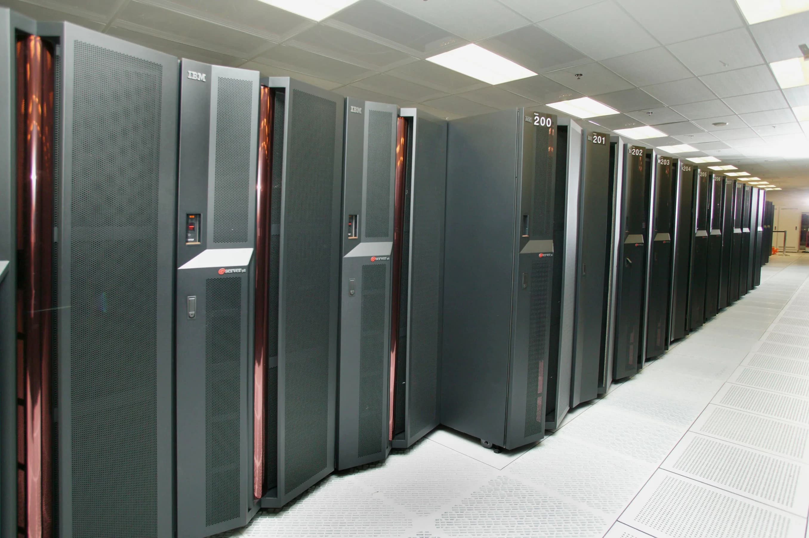 Rows of IBM mainframe and enterprise server racks in a data center