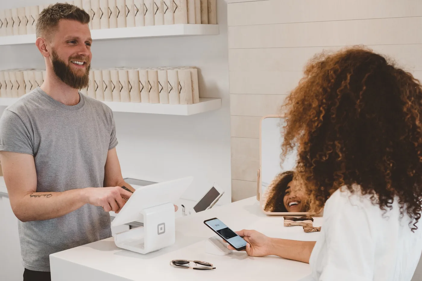 Customer completing a secure card payment at a Postnet point-of-sale terminal
